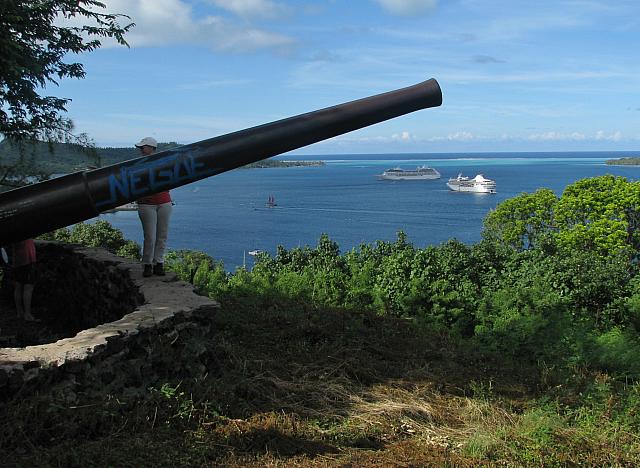 WWII U.S. Navy gun site.  Regatta and The Paul Gauguin anchored off Vaitape