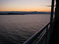 Left click on photo. Then use 'next' and 'previous' arrows to scroll through album.