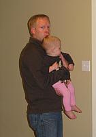 Left click on photo. Then use 'next' and 'previous' arrows to scroll through album.