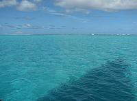 Reef in the distance...shallow water in the foreground...shadow of our sail